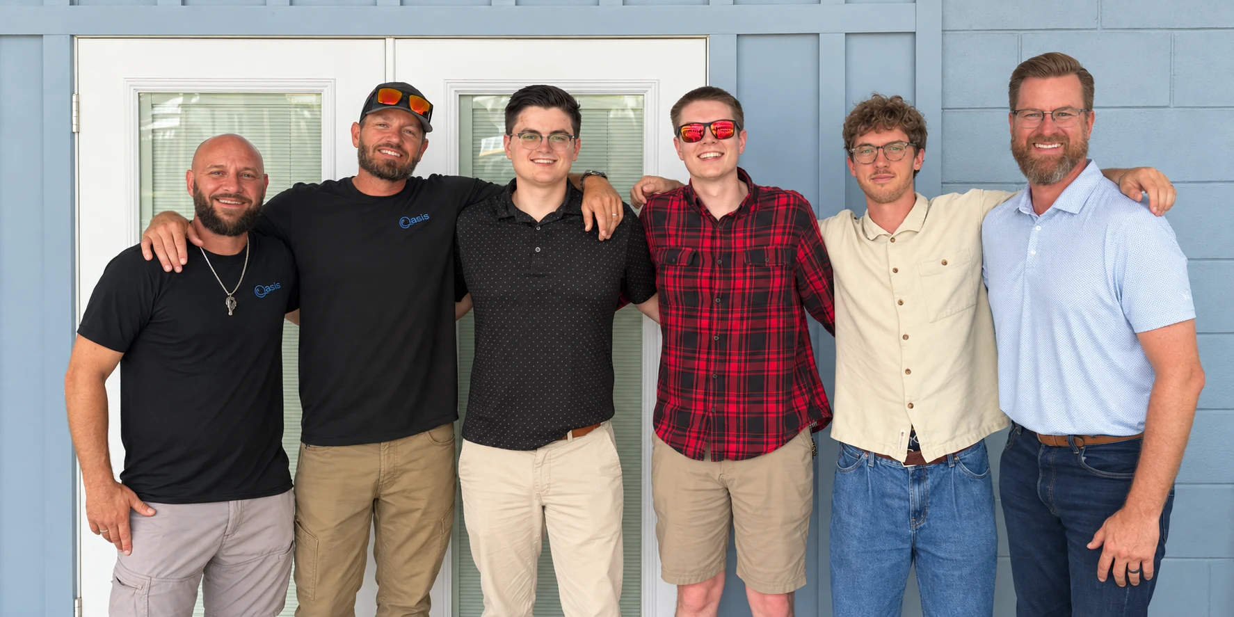 Oasis Pavers & Pools and the Byte Bot team outside the office.